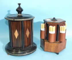 A metal-mounted stained wood "Merry Go Round" cigarette or cigar dispenser, 25cm high, 16cm diameter
