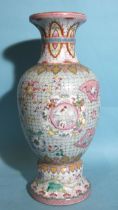 A Chinese famille rose vase finely-decorated with intricate panels of birds and on a floral