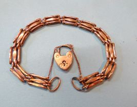 A 9ct rose gold gate-link bracelet with padlock clasp, 20cm long, 9.4g.