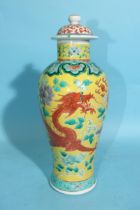 A 19th century Chinese famille verte yellow-ground 'Dragon' vase and cover, character mark to