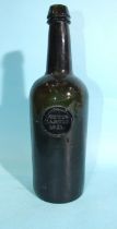 An English green glass sealed and dated wine bottle, with seal for Picton Castle 1831.