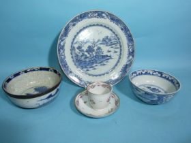 A Chinese Nankin dish with landscape decoration, a 19th century crackle glaze blue and white bowl, a