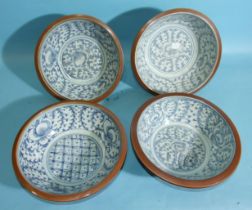 A set of four Chinese large bowls with floral decoration and café-au-lait exteriors, 28cm diameter.