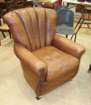 A modern leather-upholstered armchair.