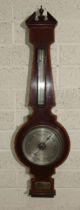 An Edwardian crossbanded mahogany aneroid barometer and thermometer, the silvered dial marked Owen &