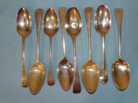 A collection of eight 18th century silver fiddle pattern tablespoons, various dates and makers,