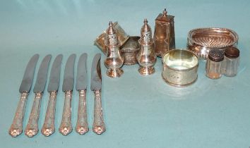 Three various silver napkin rings, a silver salt (no liner), a pair of pepper pots, 8cm high,