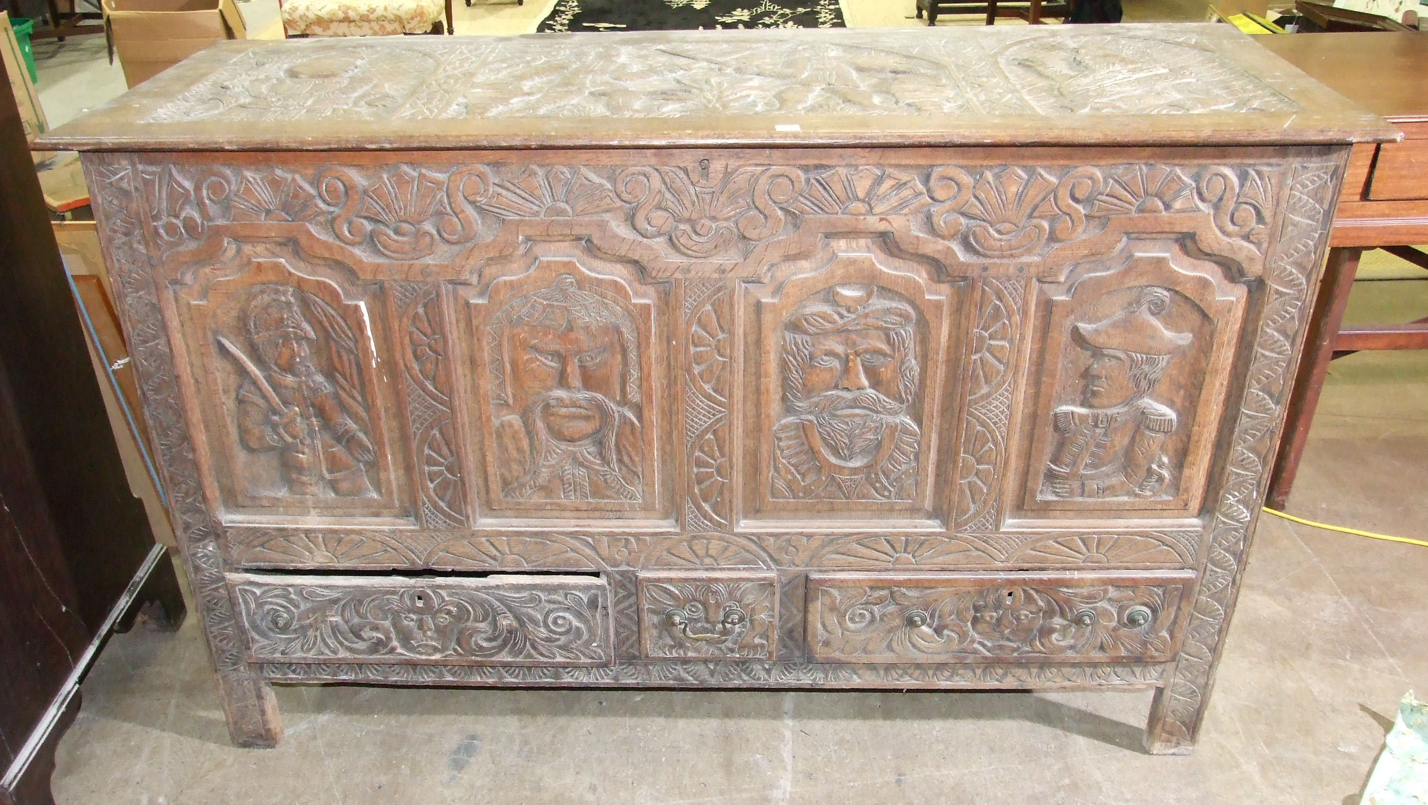 A large carved oak mule chest fitted with drawers beneath, 153.5 x 54.5cm, 95cm high.