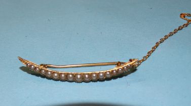 A 19th century gold crescent brooch set graduated demi pearls, (tested as 15ct approx), 4.5cm