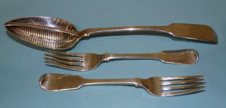 A white metal fiddle pattern gravy straining spoon and two fiddle pattern forks marked GG & Co, (3).