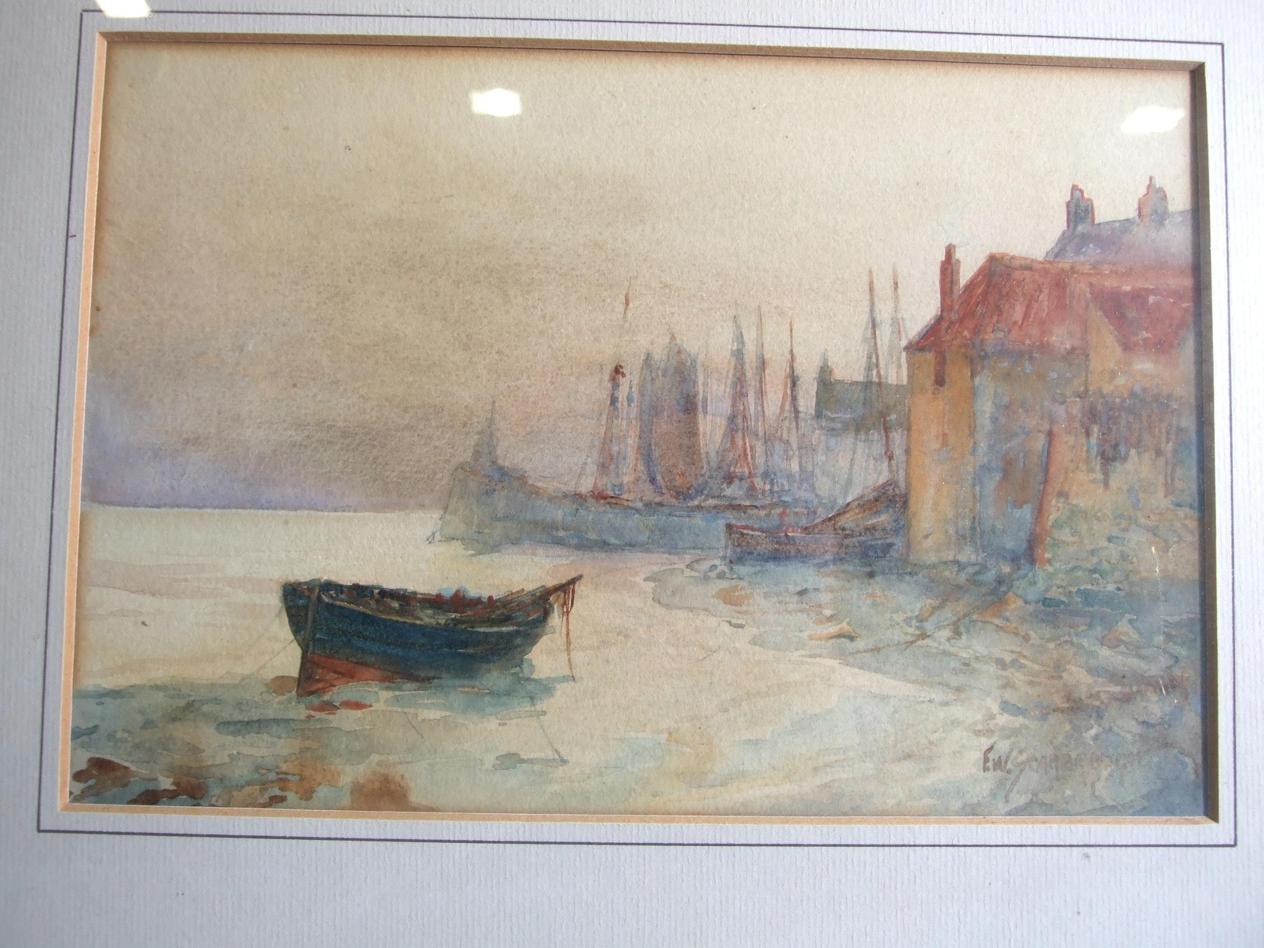 Frank William Scarbrough (1860-1939) VESSELS MOORED WITH BUILDINGS ASHORE AND LIGHTHOUSE BEHIND - Image 4 of 7