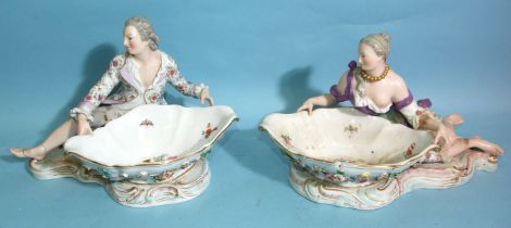A large pair of 19th century Meissen porcelain sweetmeat dishes formed as a man and woman