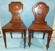 Two 19th century mahogany hall chairs with solid seats, on turned legs, (2).