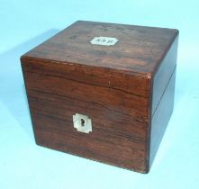 An early-19th century rosewood fitted box containing four cut-glass silver-mounted bottles dated