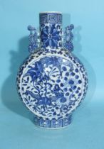 A 19th century Chinese blue and white 'Dragon' moon flask, (slight bruise to rim), 26cm high.