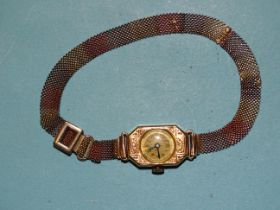 A lady's 18ct gold-cased wrist watch (not working), on 9ct tri-colour gold chain-mail bracelet,