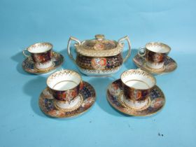 A Chamberlains Worcester Imari pattern sucrier and cover and four cups and saucers, pattern no.