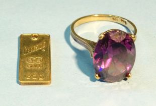 A 9ct gold dress ring set synthetic purple stone, P 1/2, 5.6g and a 9ct gold pendant, 2.5g.