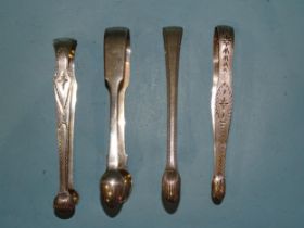 Two pairs of Georgian bright-cut silver sugar tongs and two others, various dates, ___5oz, (4).