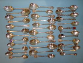 A collection of silver decorative teaspoons, including one by Liberty & Co, Birmingham 1910,