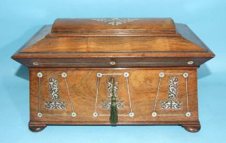 A Regency rosewood sarcophagus-shaped tea caddy inlaid with mother-of-pearl, having two lidded