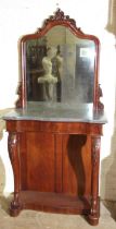 A mid-19th century pier table, the arched moulded mirror with carved cresting, above the