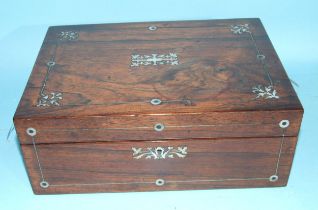 An early-19th century rosewood and mother-of-pearl-inlaid sewing box, the fitted interior with