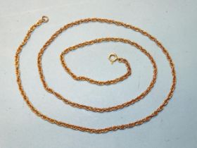 An unmarked rope-twist yellow metal chain, 68.5cm, 14g.