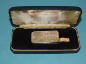 A Johnson Matthey 100g fine silver ingot, in case.