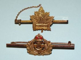 A 9ct gold and enamel Royal Navy sweetheart brooch and another, "Canada", 6.8g.