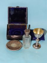 A Victorian travelling communion set, comprising chalice with knopped stem, patten and holy water/