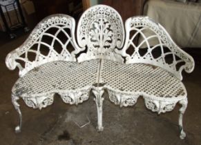 A painted cast alloy triple garden seat, 144cm wide.