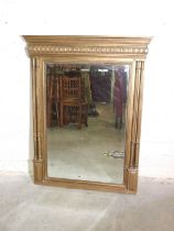 A gilt-painted over-mantel mirror, the rectangular bevelled plate beneath a moulded cornice,