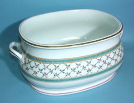 A Minton oval foot bath of bellied form with carrying handles and decorated with a band of