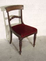 A set of ten early-Victorian rosewood dining chairs with drop-in seats, on turned and carved