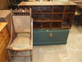 A pine boot box, 57 x 120cm, a caned seat and back rocking chair, and a painted wood tool chest,