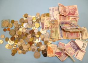 A collection of various coins and bank notes, mainly foreign.