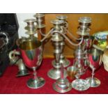 A pair of plate three-light candelabra, 27.5cm high, a plated wine funnel and other plated ware.