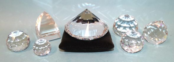 A Swarovski Chaton swirled large paperweight (A 7433 NR000 001), a pyramid-shaped paperweight and