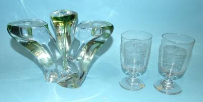 A modern heavy glass triple candle holder tinged with green and indistinctly-signed, 16.5cm high,