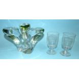 A modern heavy glass triple candle holder tinged with green and indistinctly-signed, 16.5cm high,