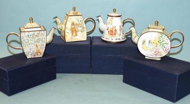 A collection of four Trade Plus Aid Peter Rabbit themed enamel teapots, (boxed), (4).