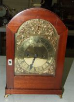 A mahogany arch-shaped bracket clock, the brass dial marked Goldsmiths & Silversmiths Company, 112