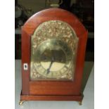 A mahogany arch-shaped bracket clock, the brass dial marked Goldsmiths & Silversmiths Company, 112