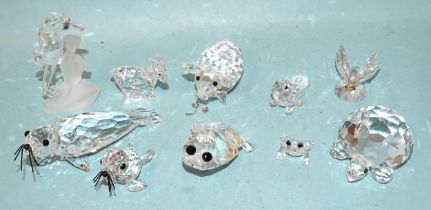 Swarovski, a collection of ten small animal figures, including seahorse, frog-prince, pig (tail