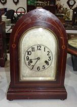 An early 20th century lancet shape mantel clock with chiming movement and pendulum, 36cm high, and