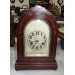 An early 20th century lancet shape mantel clock with chiming movement and pendulum, 36cm high, and