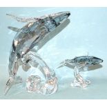 A Swarovski Crystal Society Twenty-Five Years Sculpture Paikea Whale 2012 and a Paikea calf, both in
