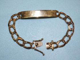 A gold identity bracelet with curb links, marked '14k', 18.5cm, 26g.