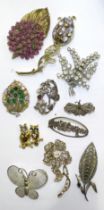 Twenty-five costume brooches.